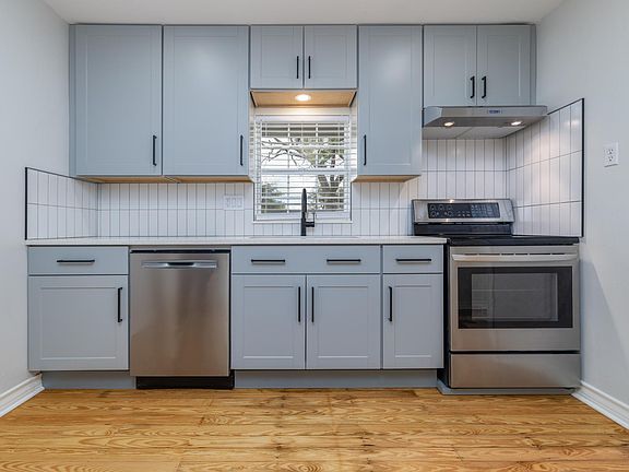 Quartz counter-top, dishwasher, garbage disposal, plenty of storage.