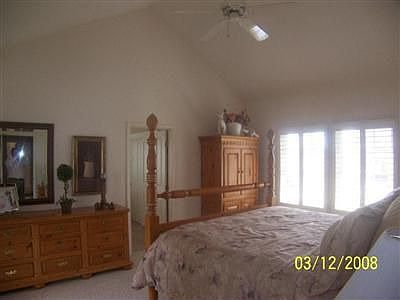 Master Suite With a deck Overlooking the Backyard