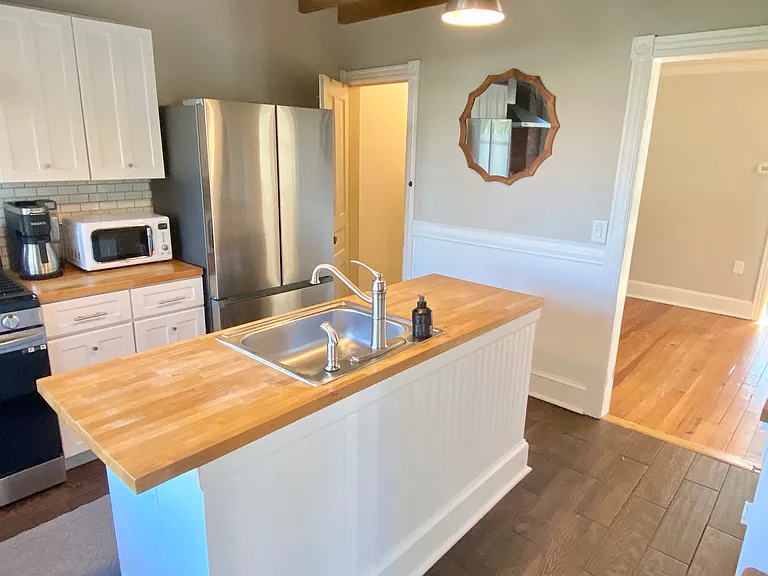 Updated kitchen and basement door in left corner