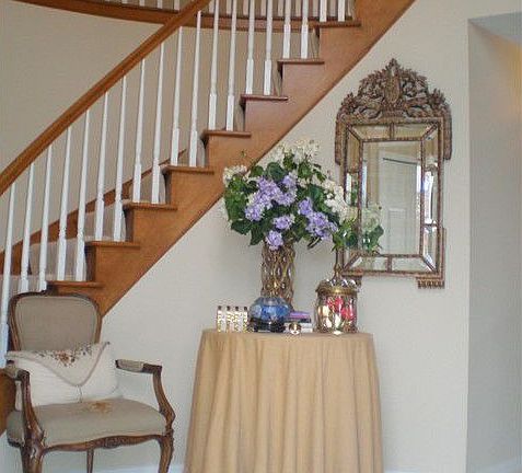 2 story foyer with curved staircase and marble floor