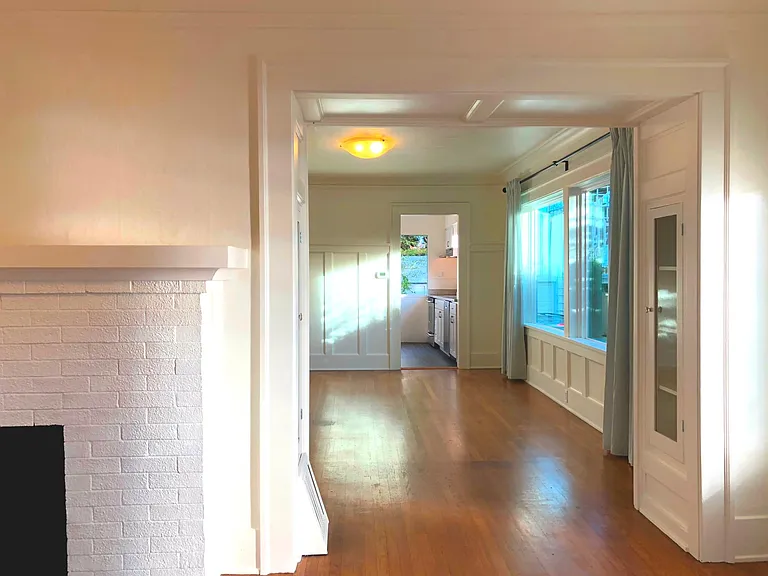 Living room flows to dining room and kitchen.