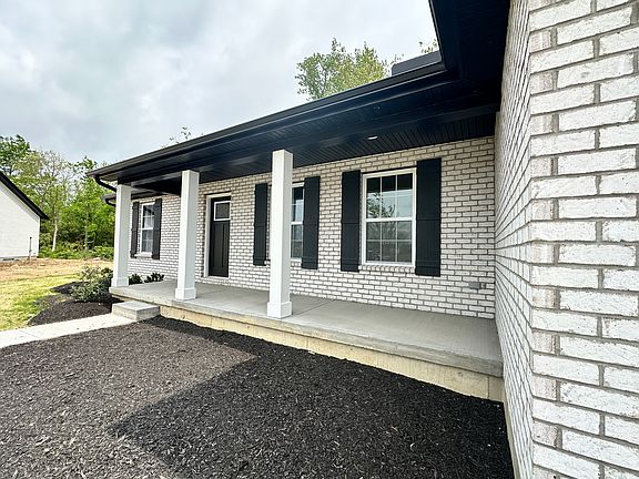 The Augusta by Todd Homes Elevation C with a Full Covered Porch