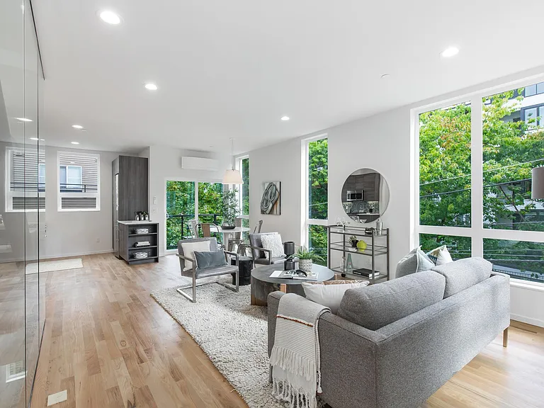 Corner unit with floor to ceiling windows on 3 sides on every level
