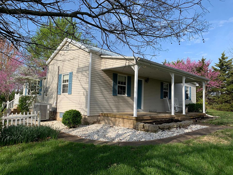 Large front porch with pond view.