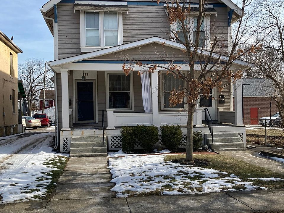 The unit on the left, with a quaint front porch.