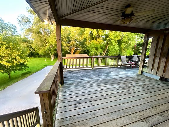 Spacious covered deck overlooking the backyard _ perfect for relaxing or entertaining.