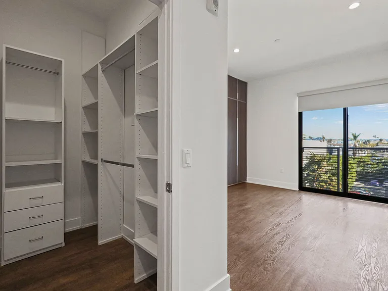 Bedroom with Walk-In Closet with Built-In Organizers