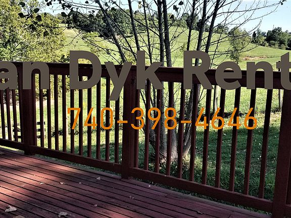 Close up off the side of the deck into the cow fields.