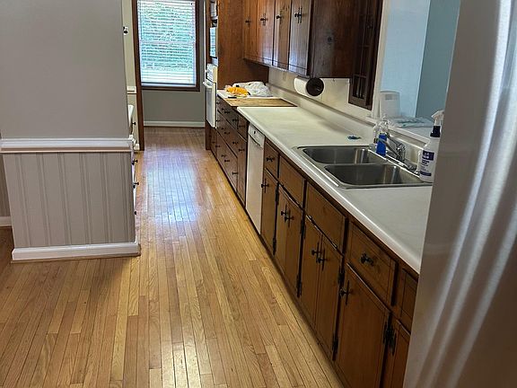 Kitchen (all electric) that also leads to the laundry area. Cabinets have pullout shelves