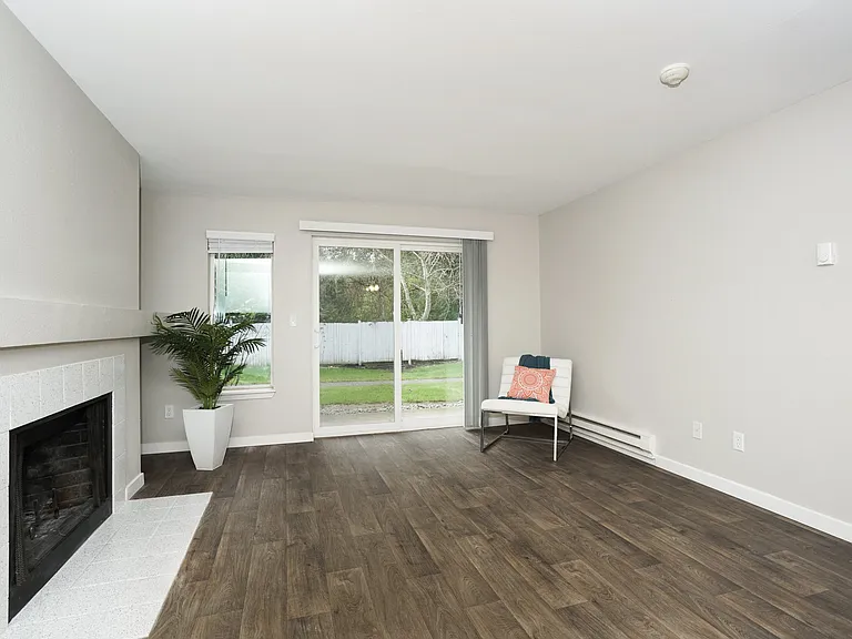 Novela Apartments Living Space Slider Door to back yard