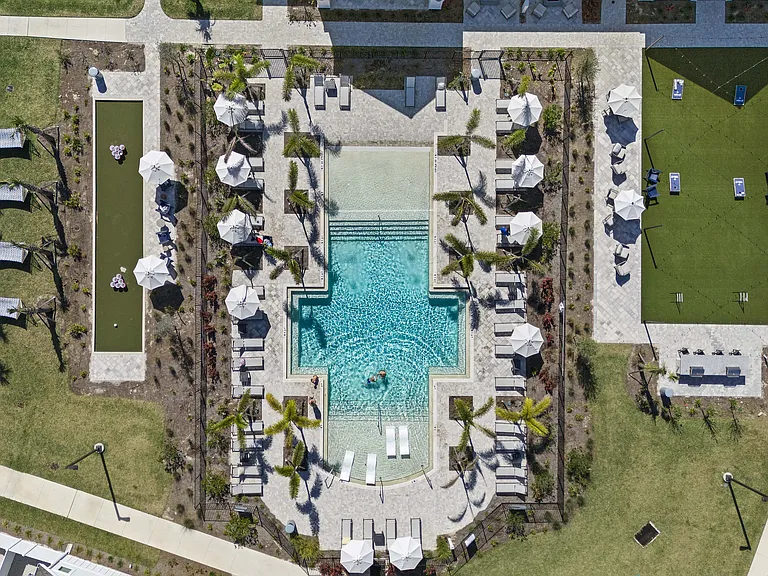 Experience luxury living with this breathtaking outdoor pool area, perfect for relaxation and leisure.