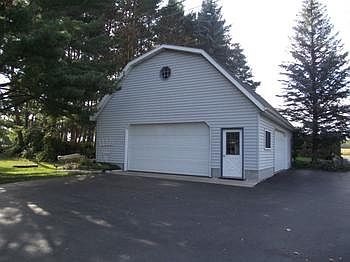 This 30X40 garage has  a 100 amp service, concrete floor, 2 16 ft.overhead doors and an upper level for storage for all the toys.