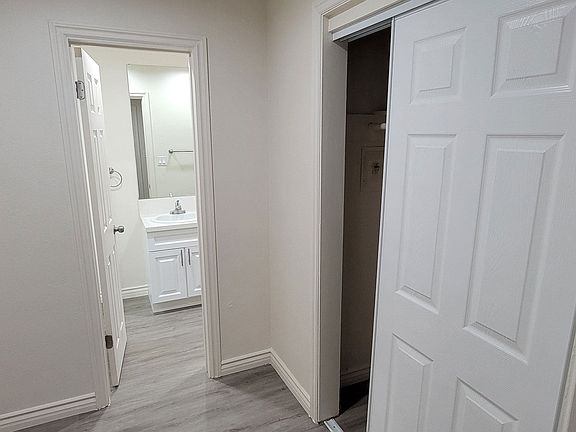 Dressing room with closet and bathroom at Orlando Woods in El Cajon, California.