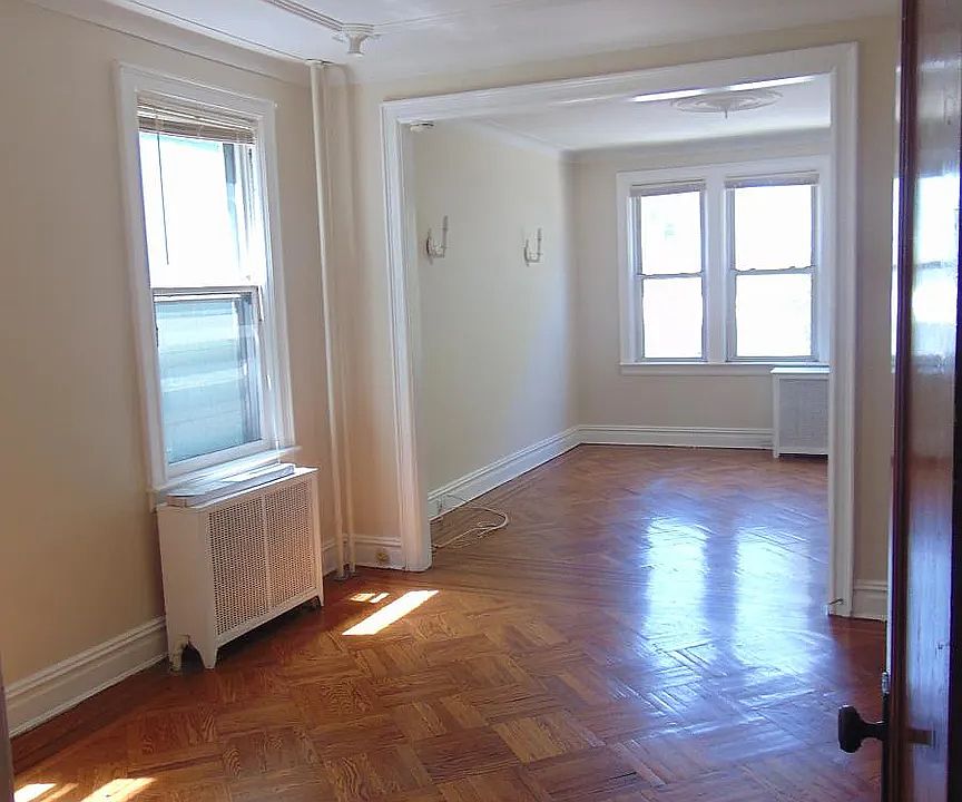 Dining room and living room feature high ceilings and hardwood floors.