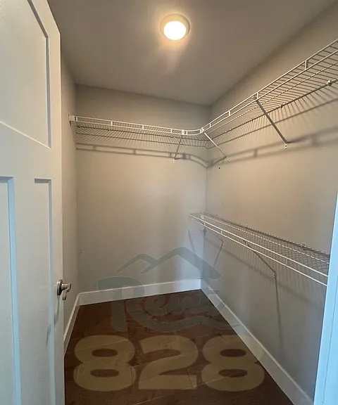 walk in closet in primary bedroom