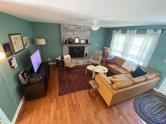 The cozy living area includes ample seating and a 50 inch smart TV. Note that the fireplace isn't operable.