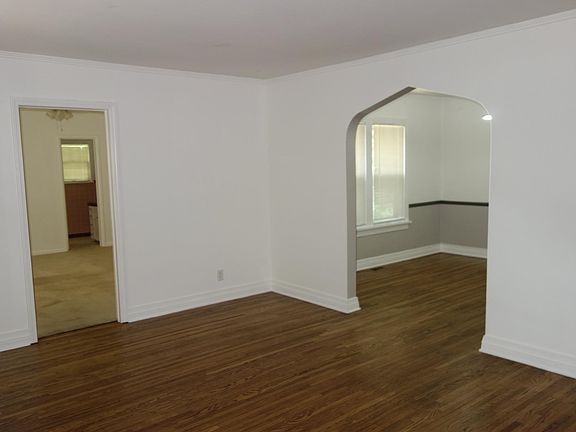 Looking left from the entry you can see the secondary bedroom on left and dining room on the right.