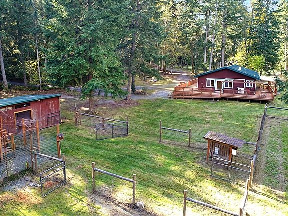 View of the barn, chicken coop and eastern side of the home.