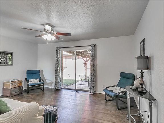 Beautiful original oak floors, newly refinished in your cozy living area that opens out to covered patio.