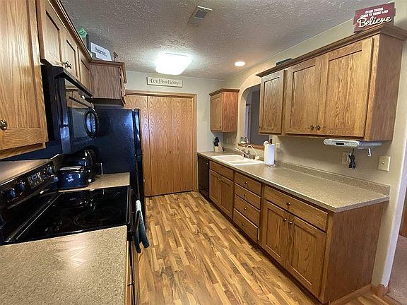 Laundry located by kitchen.