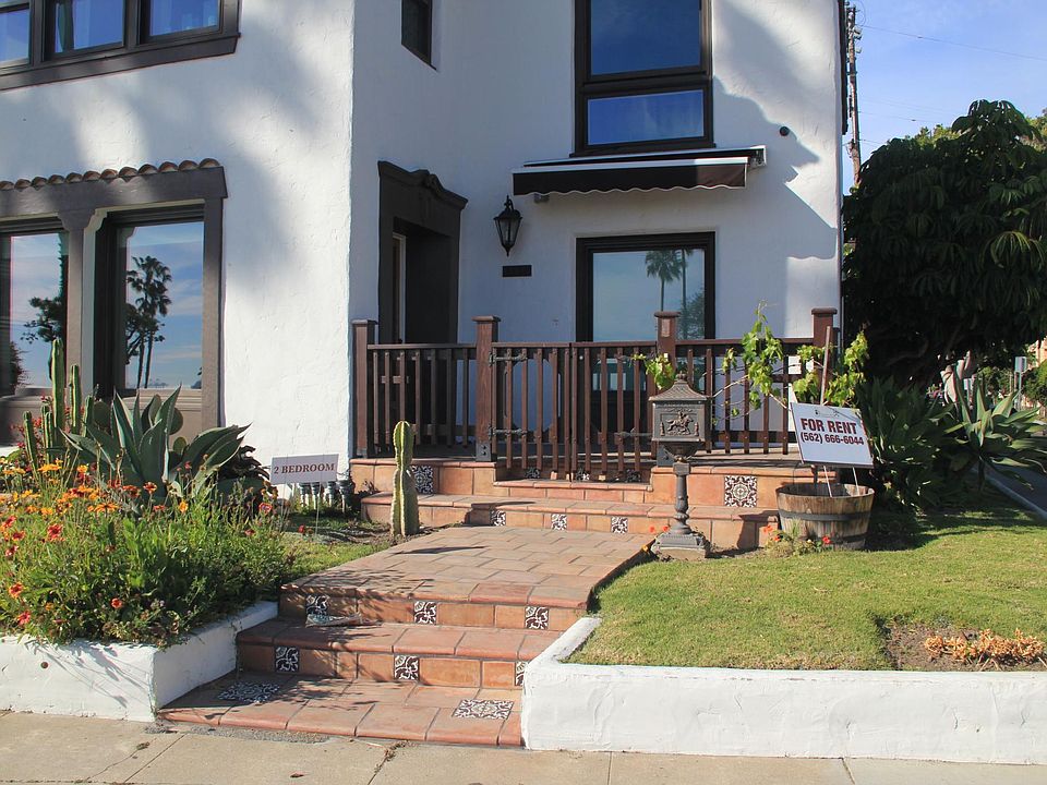 Front view of unit. It faces the ocean. The front patio, the living room windows on the left and the Dining room window on the right.