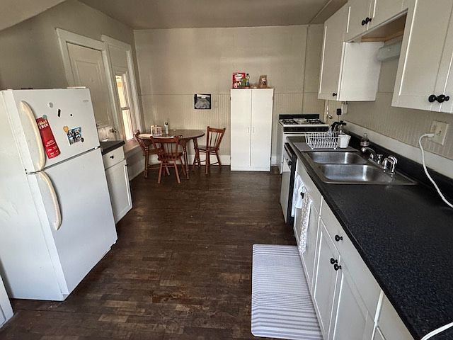 Very large kitchen. Note to the back left is a pantry/another room that can be used for storage