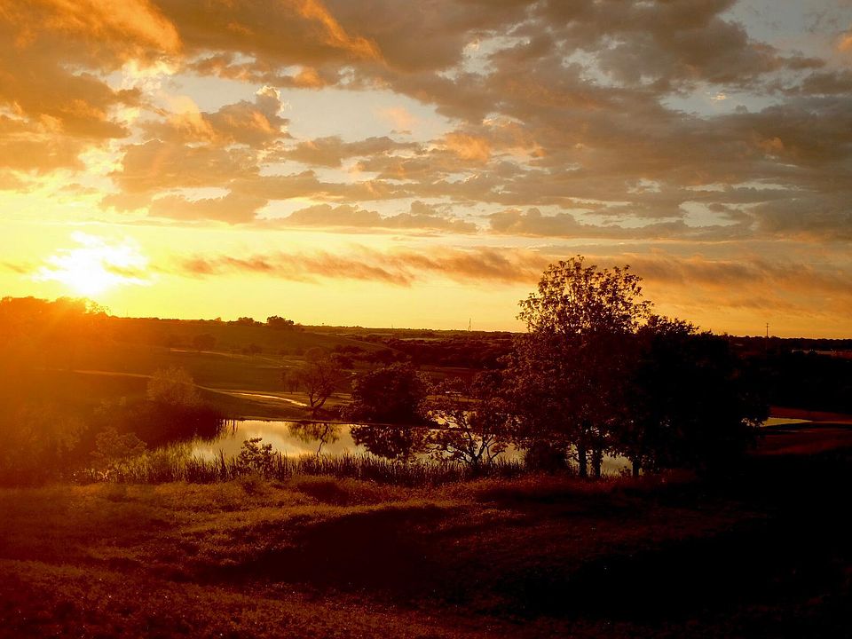 Sunset from upstairs and downstairs windows overlooking the golf course towards the West.
