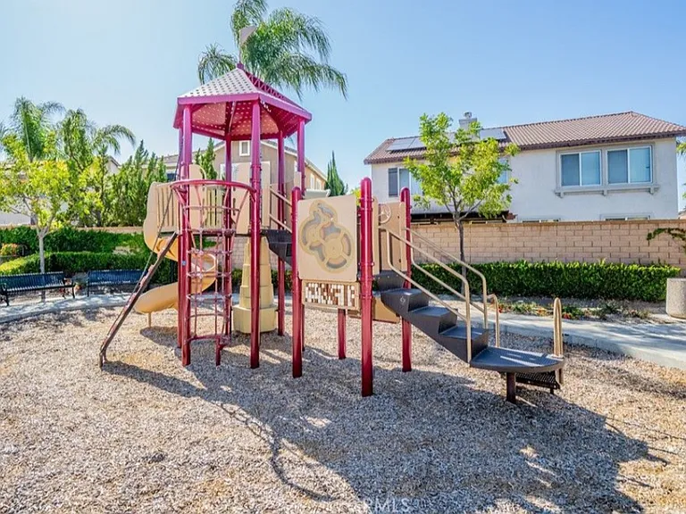 The community playground is a block away from the home. The playground has a nice shade structure too.