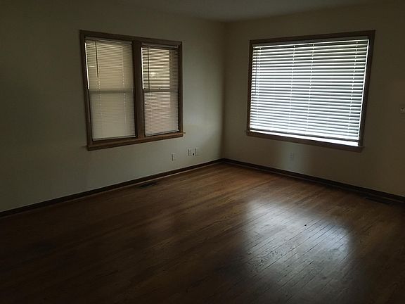 Large living area with original hardwood floors