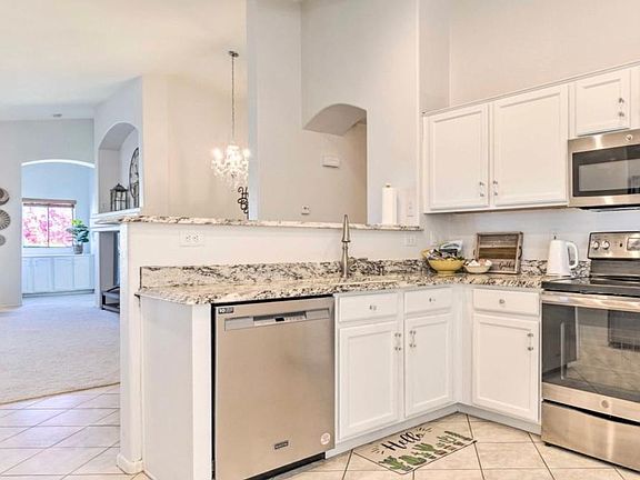 Fully furnished and equipped kitchen with new ss appliances & garbage disposal. Open concept to spacious dining and living room.