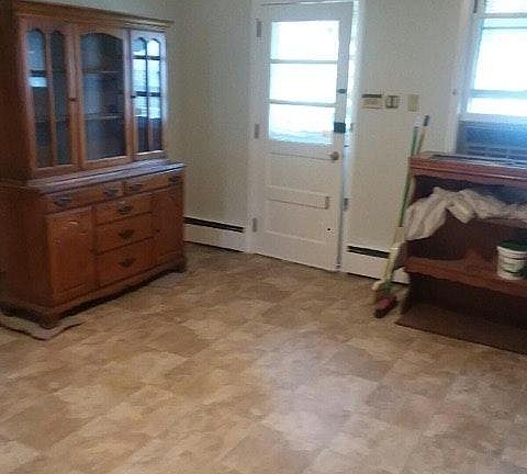 Other side of kitchen and back door to porch.