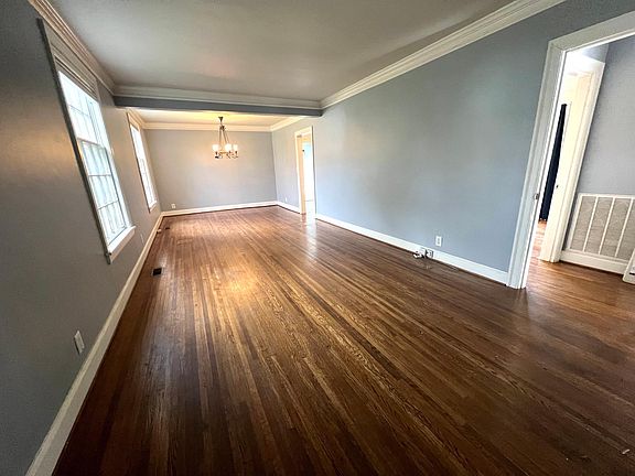 long living room and dining room that connects to kitchen and hallway