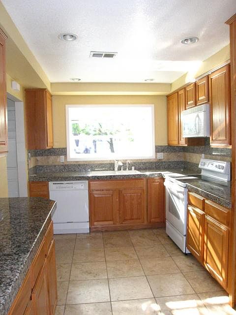 Large kitchen with granite counters