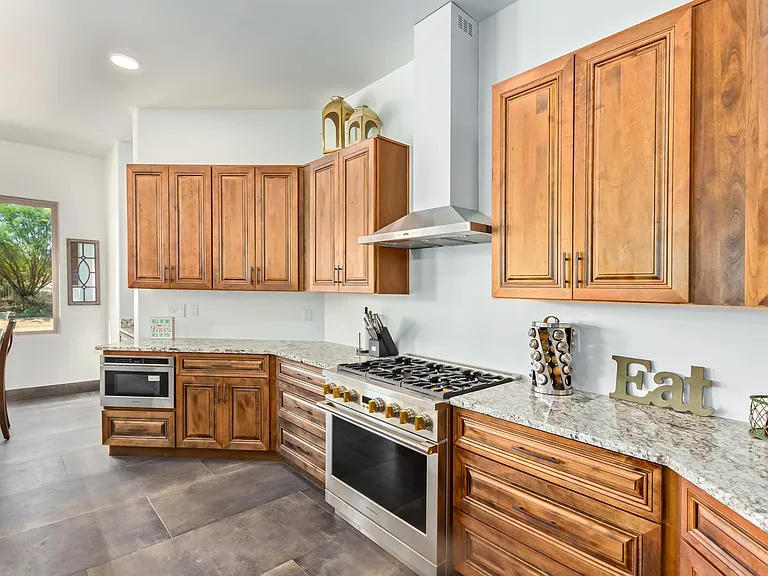 MONOGRAM GAS RANGE, SS HOOD. WINDOW SHADES ARE ON THEIR WAY AND WILL BE INSTALLED THIS WEEK.