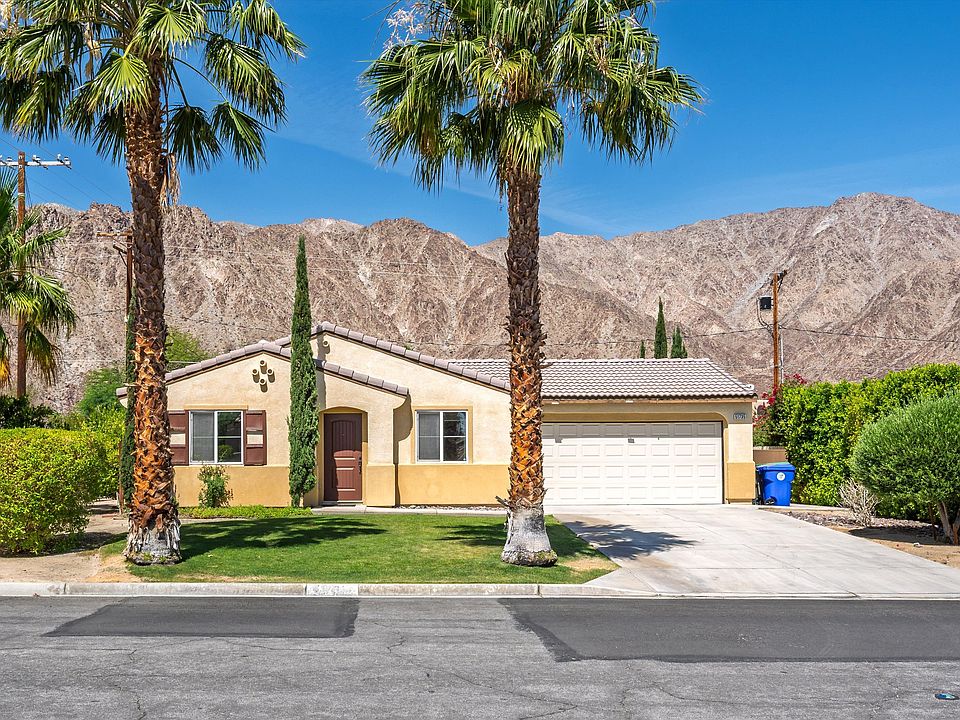 Front of home with long driveway