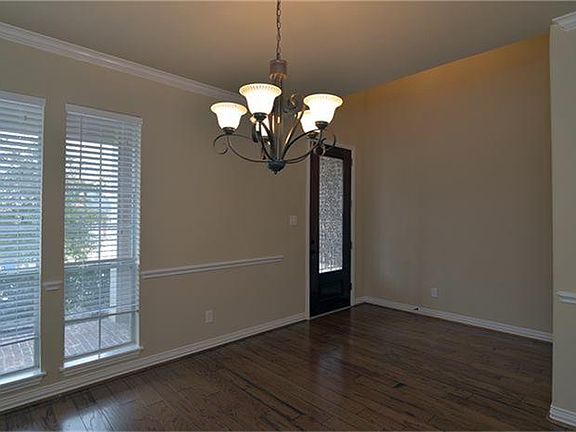 Crown molding, hardwood floors, windows on two sides, and two inch blinds!!