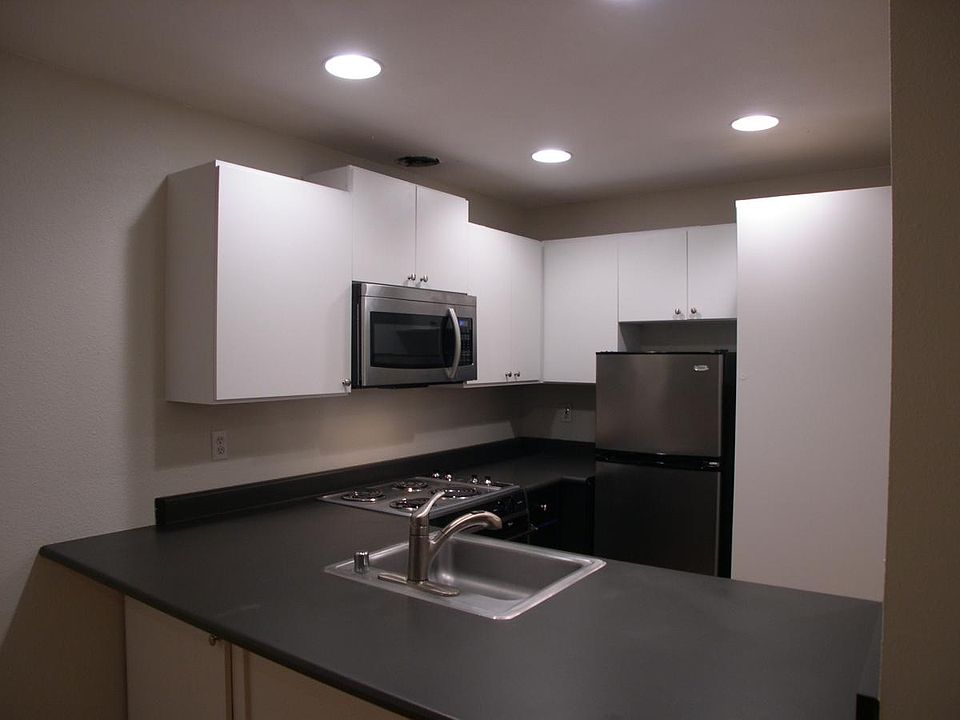 Up dated Kitchen with stainless steel appliances including microwave and dishwasher.