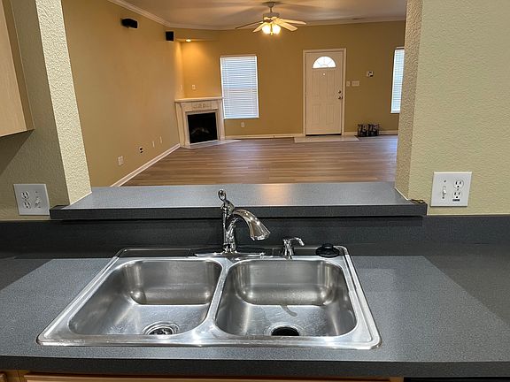 Kitchen looking through pass thru window into great room.