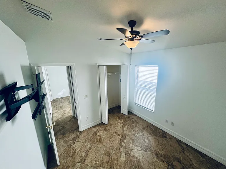 Bedroom 3. Pre mounted wall tv stand. 
Walk-in closet.