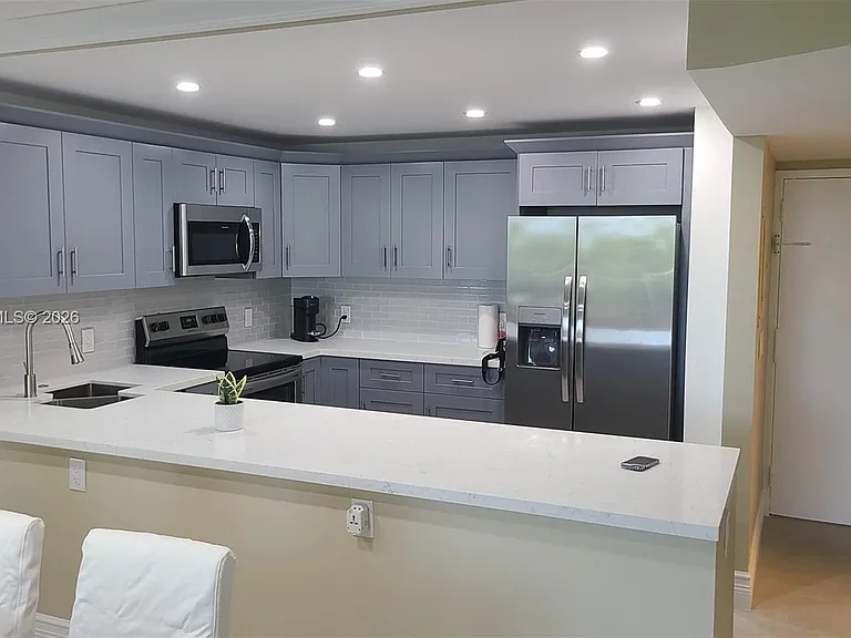 100 Golden Isles Dr #409 — Photo 23