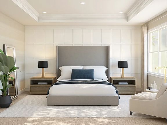 Primary suite with decorated feature wall tray ceiling