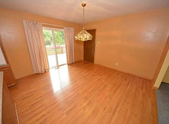 Dining room off kitchen. Sliding door opens to the deck. Other door open to garage and access to low