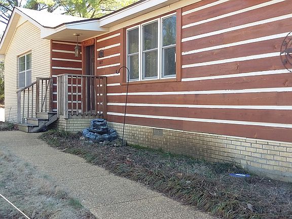 Cypress log siding