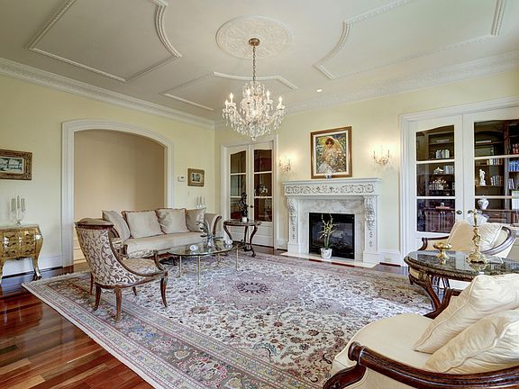 Living Room with Schonbek chandelier, 2 sided glass fireplace,