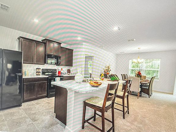 Kitchen with island and dining nook
