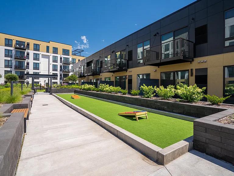 Enjoy a game of cornhole or relax in the beautifully landscaped courtyard.