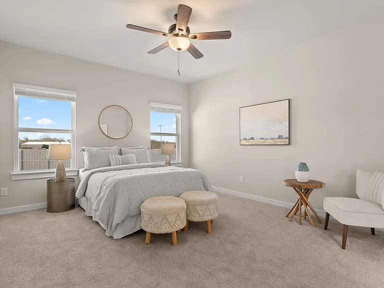 The master bedroom is large and can easily accommodate various furniture arrangements.