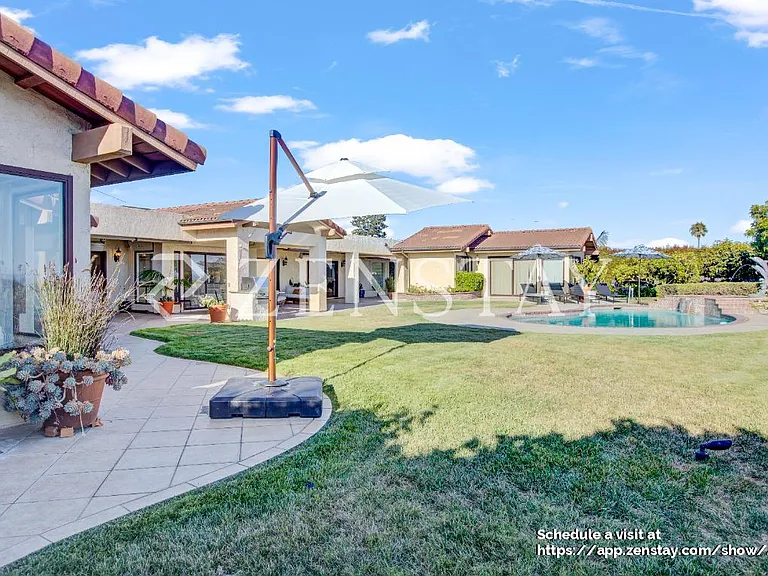 Manicured green space ideal for entertaining or relaxation