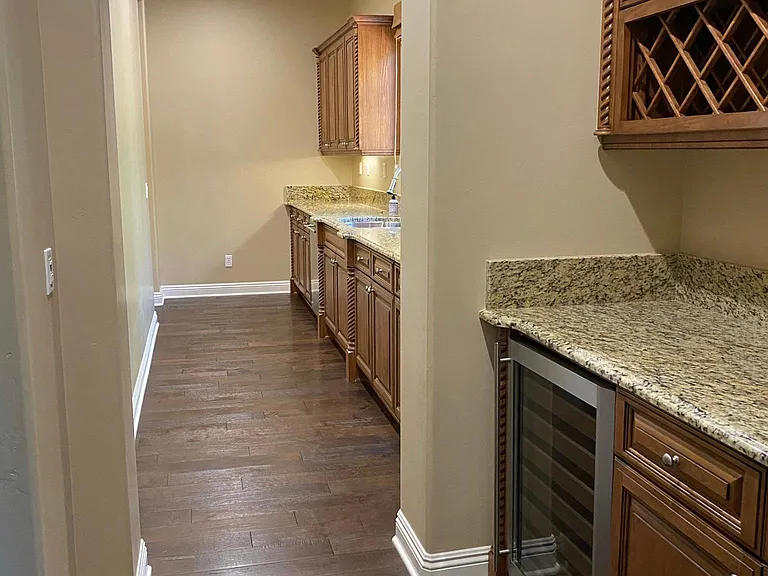 Huge butler's pantry with wine storage.