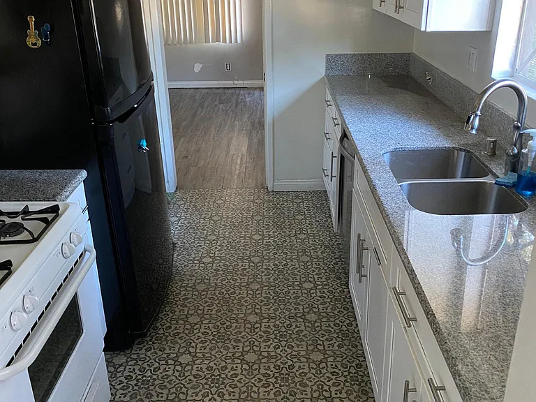 New granite counters, New cabinets and vinyl flooring